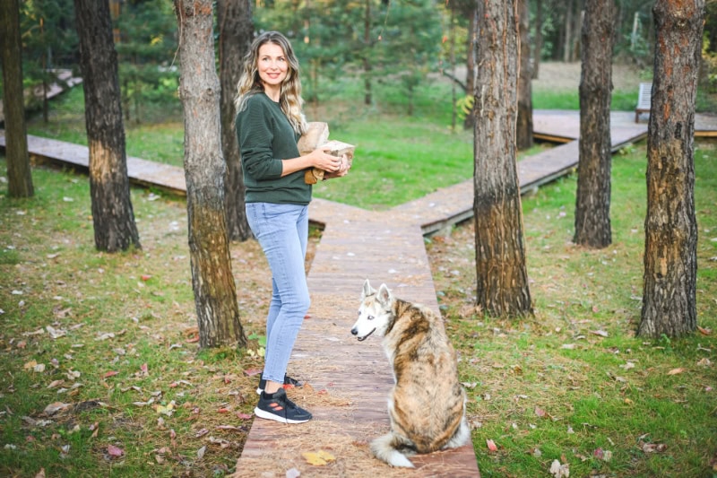 woman carrying firewood.